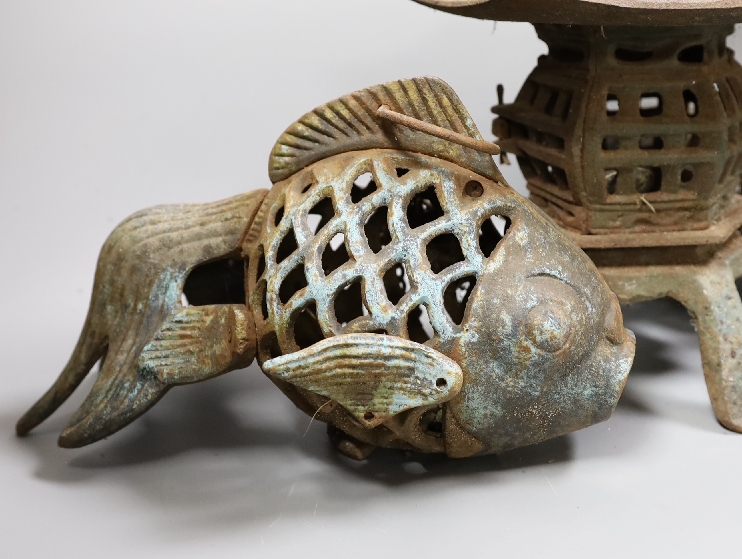 A Japanese iron lantern and two similar koi